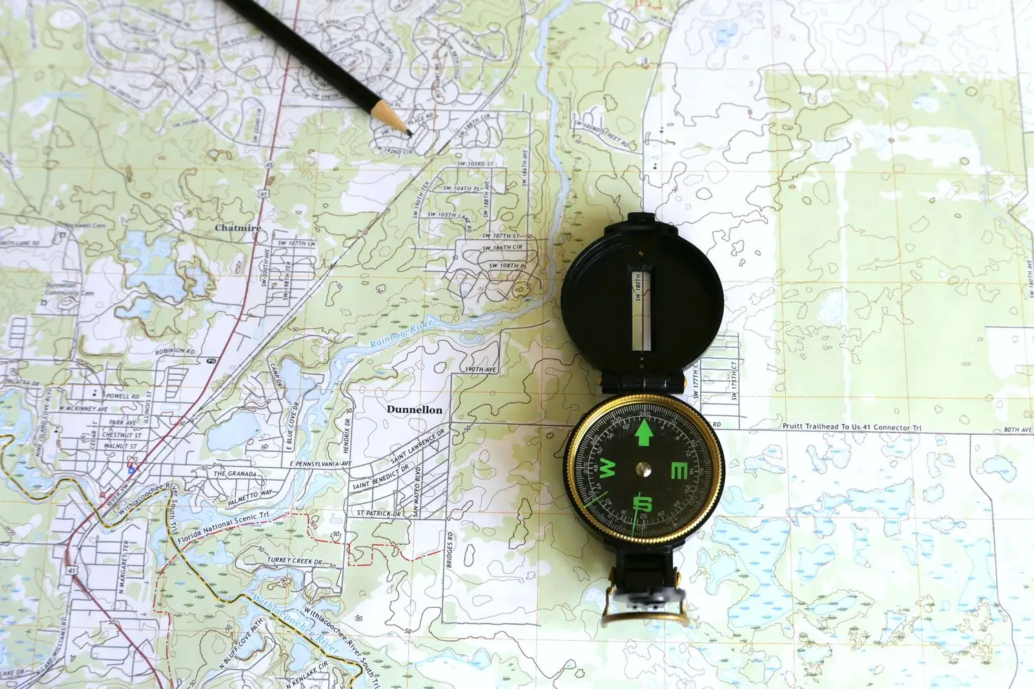 Compass resting on a detailed map