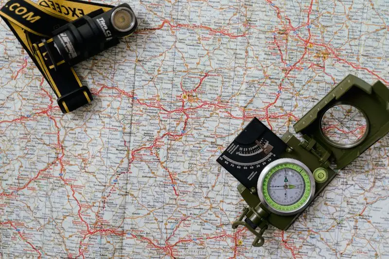 Compass and map prepared for navigation